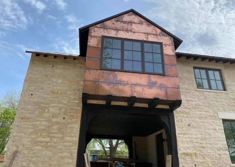 Copper metal panel facade on a stone building for Skylight Installation in Lake Mary